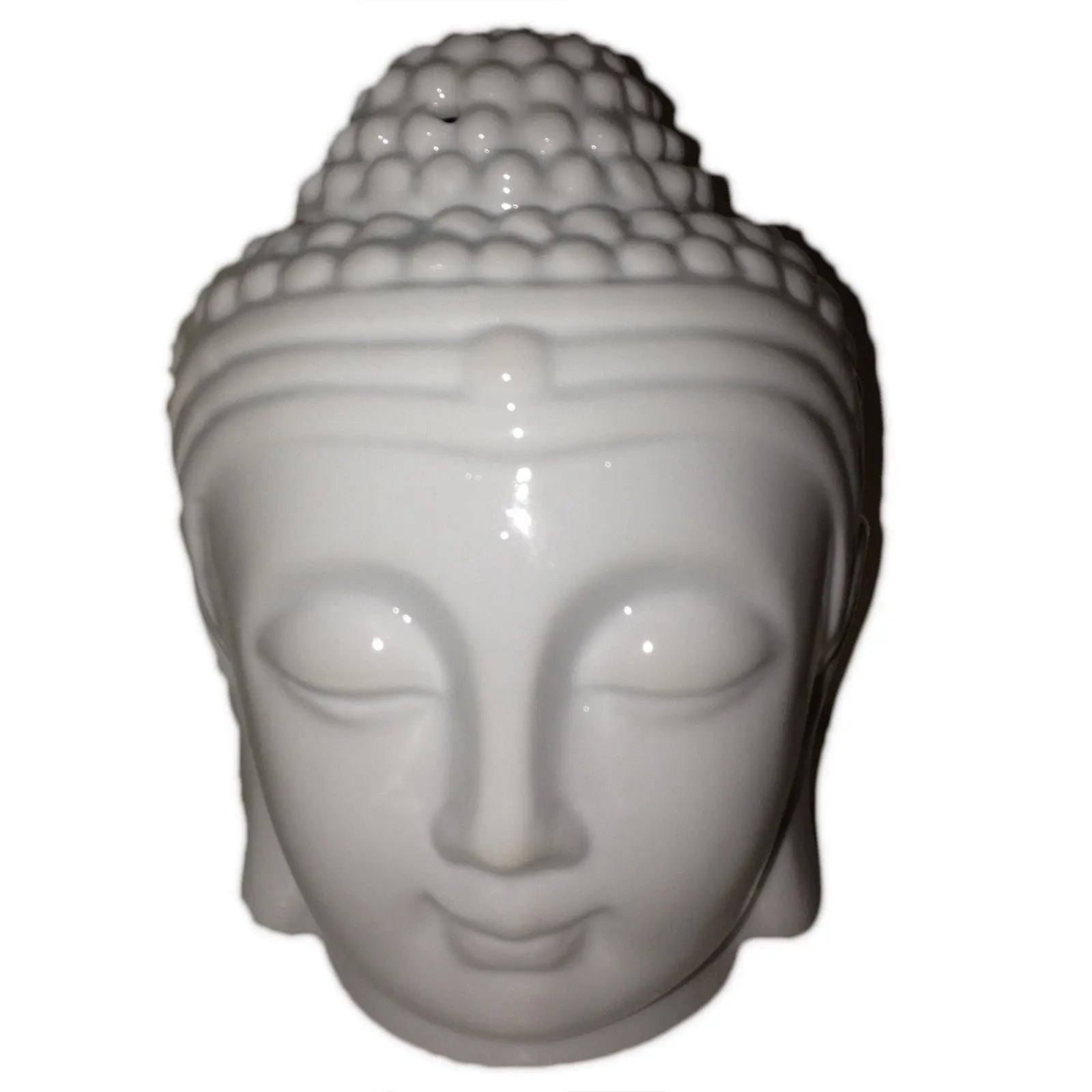 White ceramic Buddha head on a white background